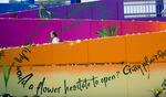 A woman pauses to read the inspirational messages included in the mural at the Hollywood Transit Center Sunday, May 27, 2018.