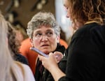 Jamie McLeod-Skinner, left, checks in with campaign manager Kelie McWilliams at the Deschutes County Democrats watch party in Bend, Ore., on Tuesday, May 21, 2024. McLeod-Skinner trailed Janelle Bynum in the Democratic primary race for Oregon's 5th Congressional District.