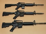 Three variations of the AR-15 assault rifle are displayed at the California Department of Justice in 2012. A federal appeals court on Tuesday upheld Maryland's decade-old ban on military-style firearms commonly referred to as assault weapons.