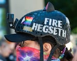 Kelly Clark sports a helmet decorated with rainbow flags and a GoPro.