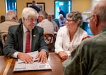 Rep. Cliff Bentz, R-Ontario, left, talks with Davina Craig of Mosier, Ore.,  before of a Rotary Club meeting in The Dalles, Ore., Aug. 20, 2025.