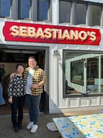 Jane Kim and her son Ed pose in front of Sebastiano's in Portland, Ore., on April 2, 2024. Jane does food reviews for their page "The Korean Mama" and gave Sebastiano's muffaletta sandwich a 9.2/10.