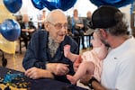 Beryl Dillman, 108, greets his newest grandchild Bella Rose Sturges at his birthday celebration on Oct. 1, 2026 in Eugene, Ore. Dillman's family believes he could be the oldest living man in the state of Oregon.