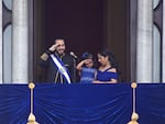 El Salvador's President Nayib Bukele and his daughter Layla salute while standing on a balcony with first lady Gabriela Roberta Rodríguez, after he was sworn in for a second term, in San Salvador, El Salvador, Saturday, June 1, 2024.