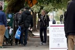 People mill around Trinity Episcopal Cathedral in Portland on Oct. 9, 2024. The cathedral's food pantry and Wednesday meals have come under fire as crime escalates in the area.