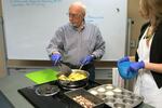Ray Spaulding cooks apples them in front of a class at the Portland VA. Standing next to him is Jessica Mooney, a clinical dietitian. About 80 percent of veterans are overweight and obese and another quarter have diabetes. Those numbers are higher than the national average for all Americans. 