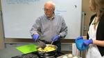 Ray Spaulding cooks apples them in front of a class at the Portland VA. Standing next to him is Jessica Mooney, a clinical dietitian. About 80 percent of veterans are overweight and obese and another quarter have diabetes. Those numbers are higher than the national average for all Americans. 