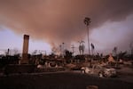 A view of damage Saturday as firefighters are still battling to control huge wildfires in Los Angeles that have devastated several areas across the nation's second-largest city.