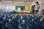 Volunteer Emergency Manager Dorothea Thurby of Warm Springs takes inventory of bottled water Aug. 2, 2019.