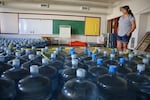 Volunteer Emergency Manager Dorothea Thurby of Warm Springs takes inventory of bottled water Aug. 2, 2019.