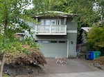 A coyote walks through a driveway in Portland's Eastmoreland neighborhood on Sept. 2, 2026.