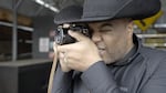 Photographer Ivan McClellan photographing at a farm near Sandy, Ore., Feb. 2, 2025.