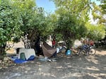 People's belongings in front of the city of Ashland's police department parking lot on Aug. 2, 2024.