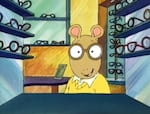 In the first episode of Arthur, the titular character (center) tries on a pair of brown glasses in "Arthur’s Eyes."