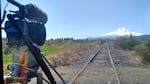 Cinematographer Brandon Swanson rigged a camera to the front of a rail speeder car to take in an epic view of Mount Hood as it traveled through an orchard.