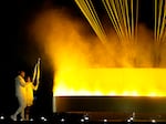 The cauldron is lit by torch bearers Marie-Jose Perec and Teddy Riner in Paris, during the opening ceremony of the 2024 Summer Olympics, Friday, July 26, 2024.