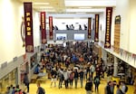 FILE - In this May 4, 2017, file photo, students head to classes at a high school in Forest Grove, Ore. High school graduation rates in Oregon, one of the lowest in the nation, rose 2 percent over the previous year to 78.7 percent. The state education department said Thursday, Jan. 24, 2019, that the asset of bilingualism is highlighted by the fact that students who exited English Learner programs before high school graduated at a rate nearly 4 percentage points higher than the statewide average. (AP Photo/Don Ryan, File)