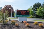 A sign in front of Tigard High School lists every student in the class of 2020.