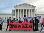 Advocates and victims of the opioid crisis gather outside the U.S. Supreme Court on Dec. 4, 2023, while the justices hear a case about Purdue Pharma's bankruptcy deal. The protesters urged justices to overturn the deal, which would give the Sackler family immunity against future civil cases related to opioids.