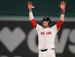 The Boston Red Sox's Danny Jansen celebrates after hitting an RBI single during the eighth inning of a baseball game against the Texas Rangers at Fenway Park, on Aug. 14 in Boston.