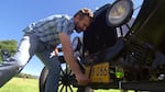OPB's Ian McCluskey tries his hand at crank-starting a Model T.
