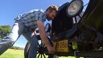 OPB's Ian McCluskey tries his hand at crank-starting a Model T.