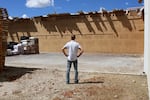 Shay Myers stands at site (now cleared) where the roof caved in on one of his onion storage sheds in Nyssa.