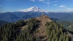 The High Rock Lookout, pictured here in a still captured by a drone in June, sits on a rocky outcrop at 5,685 feet, offering visitors an unequalled view of Washington's Mount Rainier.