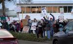 Protesters rally outside of the Tesla facility in Portland, Ore., Feb. 10, 2025, opposed to actions by President Donald Trump and Elon Musk.