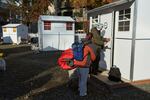 Chris Foss, right, and Tiecha Vannoy move into a new pod setup by the city in the Old Town district in Portland, Ore., Tuesday, Dec. 8, 2020.