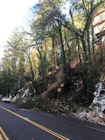 Melting ice and heavy rain is the likely cause of a landslide on Portland's West Burnside St. Debris closed traffic in both directions, January 18 2016. 