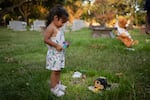 Camila Villasana at the grave of her sister, Halo. "I should have been able to release her into heaven sooner," says mom Samantha Casiano of baby Halo.