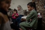 Members of the Zeita family spend time together at their home in the Palestinian village of Ein 'Arik in the occupied West Bank on March 24.