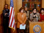 Then-Sen. Joe Biden, D-Del., stands behind a flag as Sen. Barbara Boxer, D-Calif., discusses the Violence Against Women Act on Capitol Hill on Feb. 24, 1993.