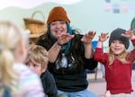 Teacher Belicia Cervantes, left, and Felix Ocasio, 4, sing a song at Escuela Viva Community School’s Southeast Portland location, Oct. 26, 2023. Staffing shortages contribute to the lack of child care options in Oregon — low pay, a lack of benefits and time off, grueling hours and work that can be emotionally exhausting all combine for a tough job that often isn’t as highly valued as other education roles.