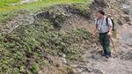 Redwood National Park Archeologist Michael Peterson surveys a stretch of eroding cliff.