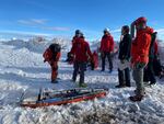 A recovery team from Portland Mountain Rescue waits for a snowcat to take them further up Mount Hood to the spot where a person was found on Tuesday, Feb. 25, 2020.