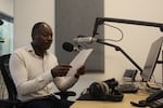 Reporter Elamin Babow reads the latest headlines in Radio Dabanga's office in Amsterdam on Oct. 16. The station is a lifeline for Sudanese people trying to get information about their war-torn country.