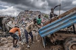 The kush epidemic is unfolding against a backdrop of poverty in much of Sierra Leone. Here, young men sort through rubble at the Kingtom dumpsite in Freetown.