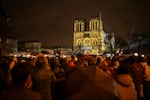 Spectators gather outside France's iconic Notre Dame Cathedral Saturday, Dec. 7, 2024 in Paris for it's formal reopening for the first time since a devastating fire nearly destroyed the 861-year-old landmark in 2019.