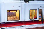 A person rides the MAX light rail Red Line train through downtown Portland, Ore., Thursday, April 29, 2020. Mass transit ridership has decreased during the COVID-19 pandemic, but many still depend on it to get around town.