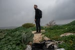 Nadav Weiman, deputy director of Breaking the Silence, walks through the abandoned Palestinian village of Zanuta in the occupied West Bank on Feb. 19.
