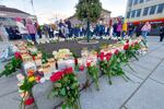 Flowers and candles are placed at a memorial after a man killed several people in Kongsberg, Norway.