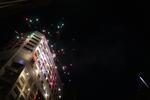 Fireworks explode outside the Multnomah County Justice Center in Portland, Ore., July 4, 2020.