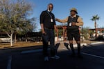 Roommates Ricky Jones, 69, (right) and Richard Crumbley, 63, make jokes after a roll call early morning at Grand Veterans Village in Phoenix.