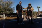 Roommates Ricky Jones, 69, (right) and Richard Crumbley, 63, make jokes after a roll call early morning at Grand Veterans Village in Phoenix.