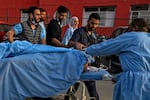Paramedics carry an injured tourist at a hospital in Anantnag, south of Srinagar, on April 22, following an attack. Gunmen in Indian-administered Kashmir opened fire on a group of tourists in one of the worst attacks targeting civilians for years in the region.