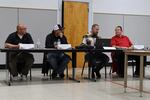 Siletz Valley School Board members Justin Mason, Siletz; Reggie Butler Jr., Siletz; Willie Worman and Mike Darcy, Siletz, listen to students and community members voice their concerns about administrators’ response to the student walkout on Indigenous Peoples Day.