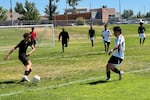 FILE - The Indomitable Lions play the Real Union in the first game of the Tri-Cities World Relief Cup. The Lions won the inaugural tournament.