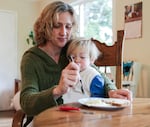 Krista Eddy sits with her son, Quinn Alexander, as they eat their breakfast, which was made using their emergency supply kit.